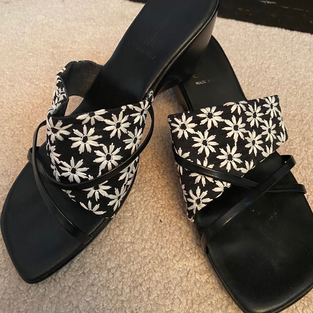 Black and white slide sandals.